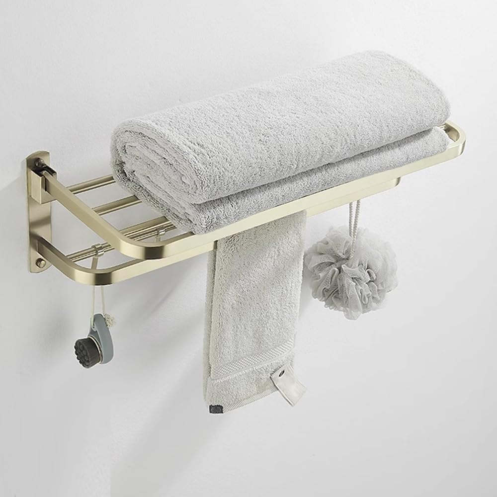 جا حوله و رخت آویز تاشو در حالت بسته، کنار دیوار